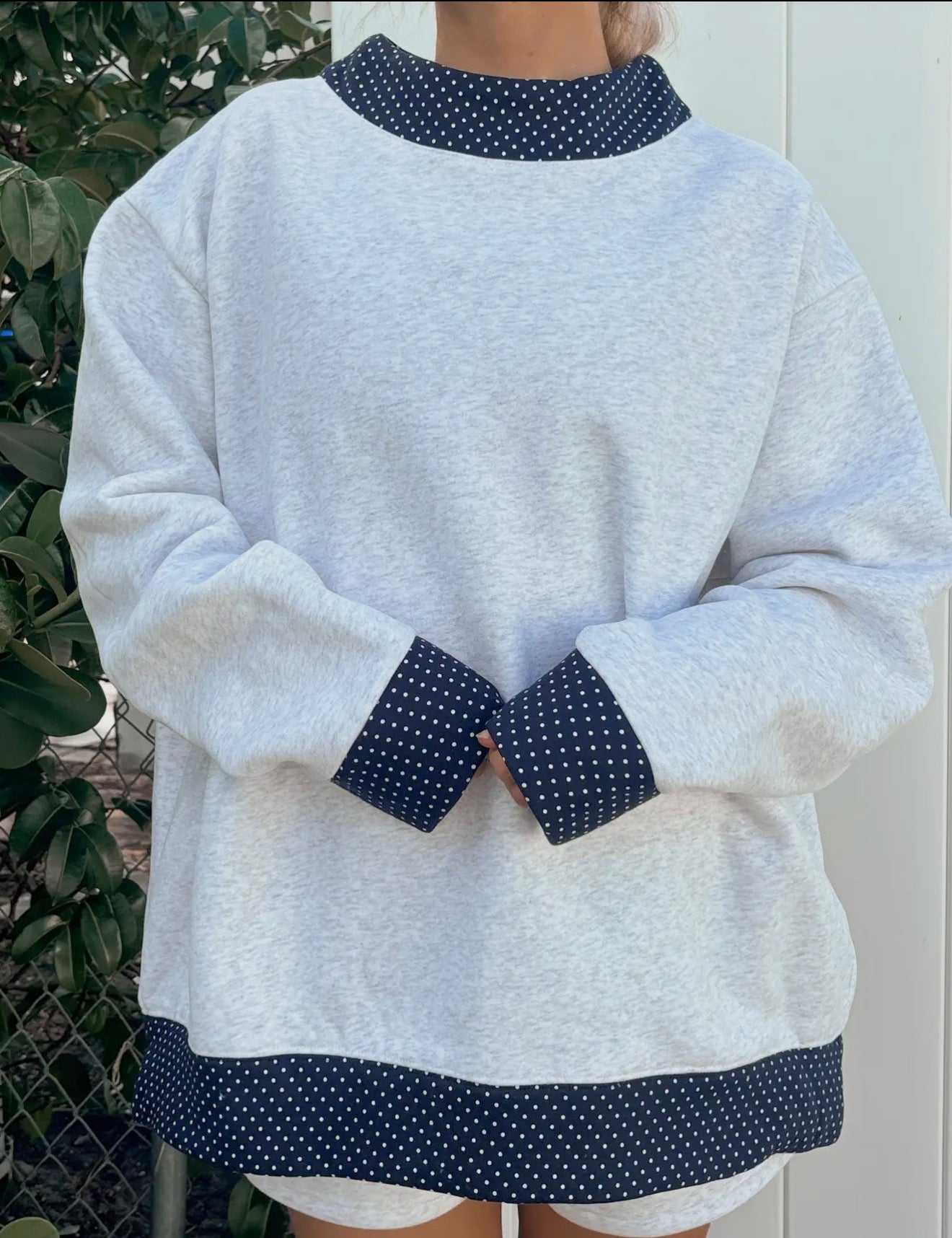Pearl gray navy blue polka dot mock-neck sweatshirt